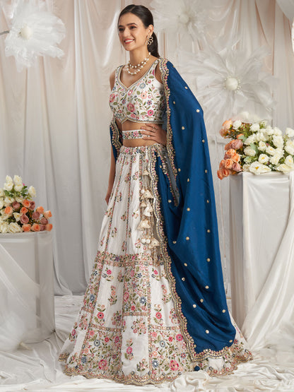 White lehenga choli paired for roka function styling