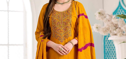 Woman wearing mustard Golden yellow viscose salwar kameez with embroidery work