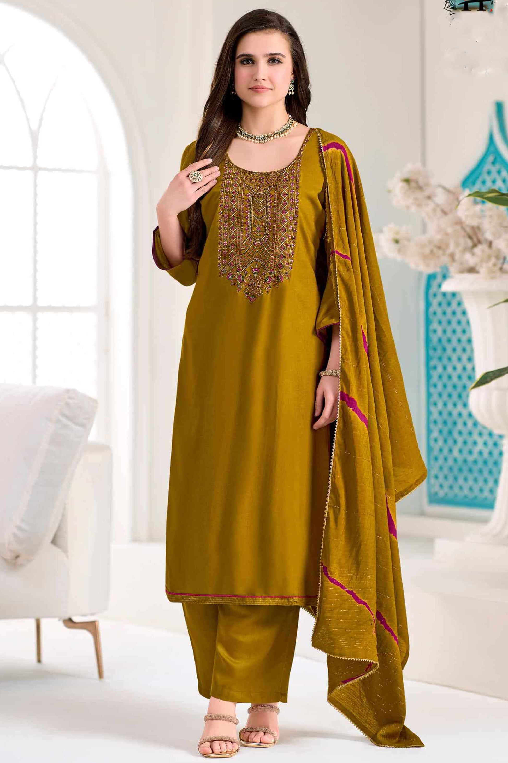 Embroidery work detail on mustard yellow outfit