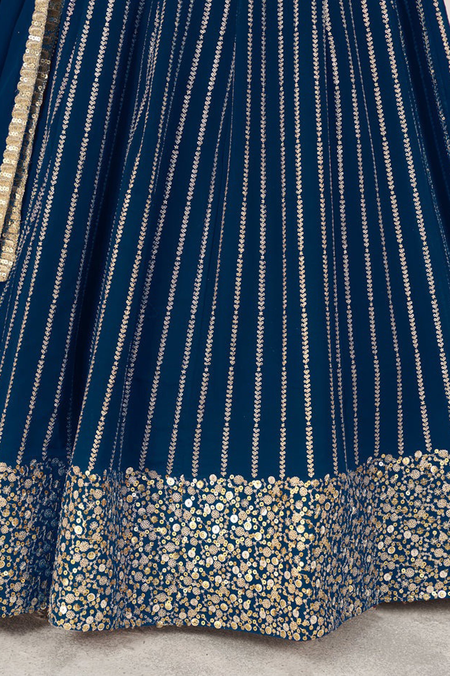 Close-up hemline zari work lehenga detail