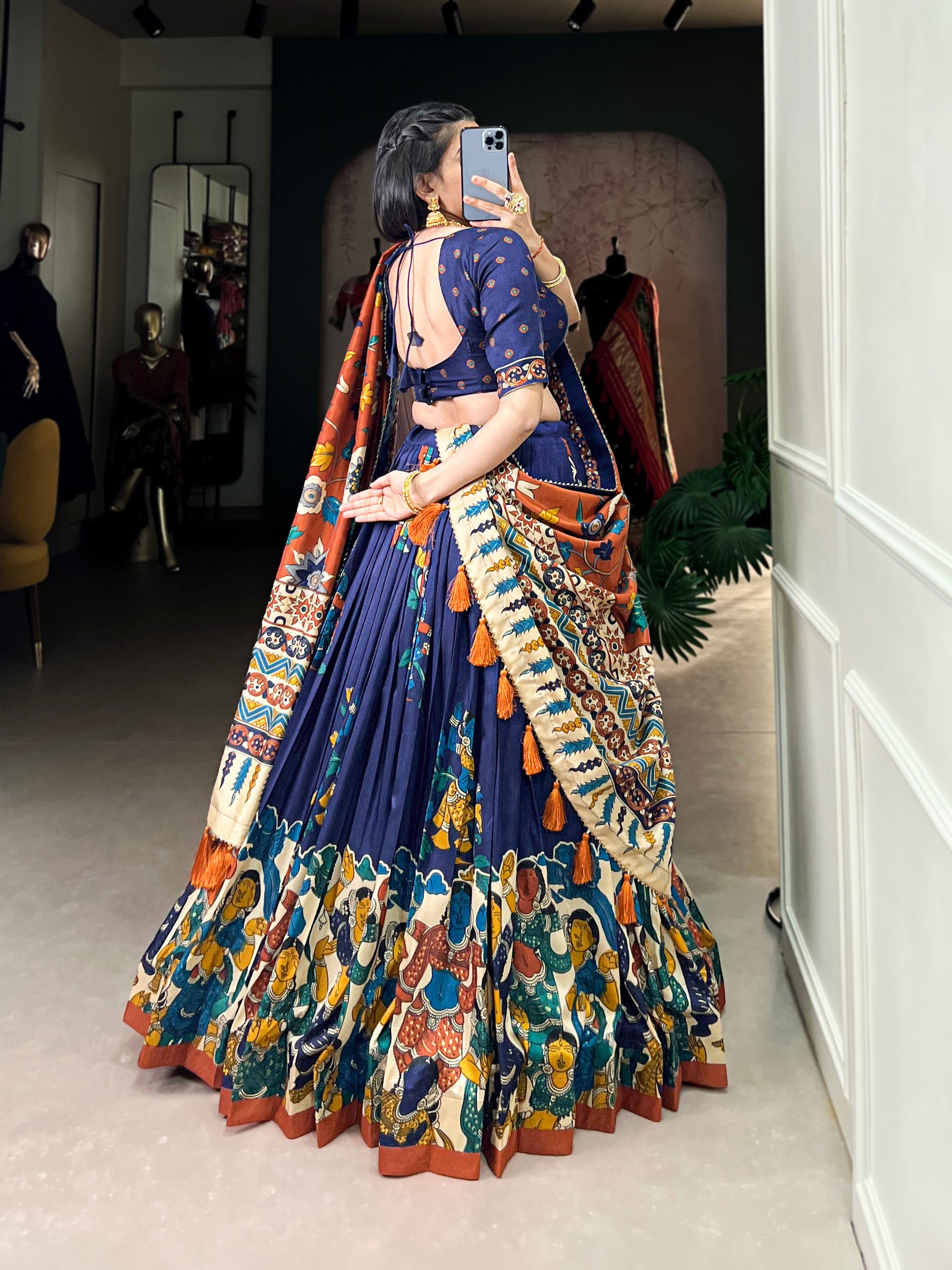 Back view of navy blue color lehenga with design detail