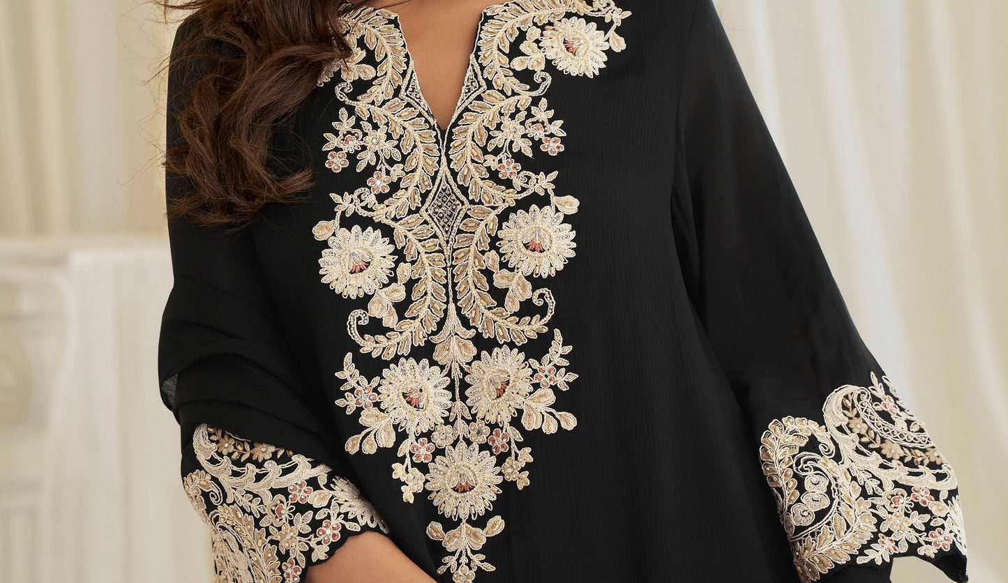 Embroidery detail on neckline of black kameez