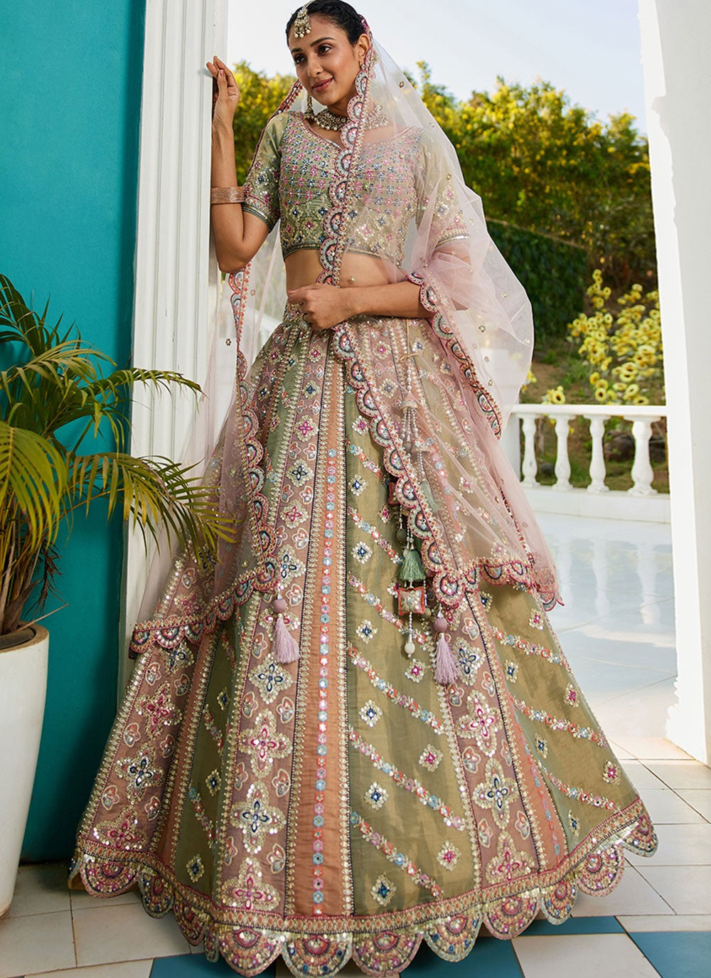 detailed embroidery and coding work on net choli blouse