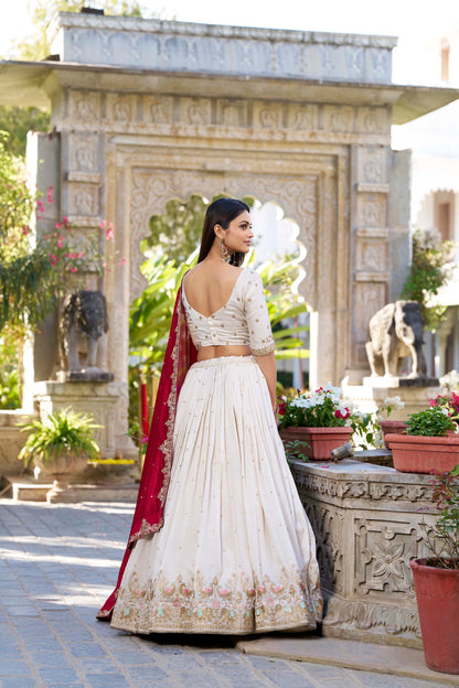 Back view of off-white lehenga with detailed craftsmanship