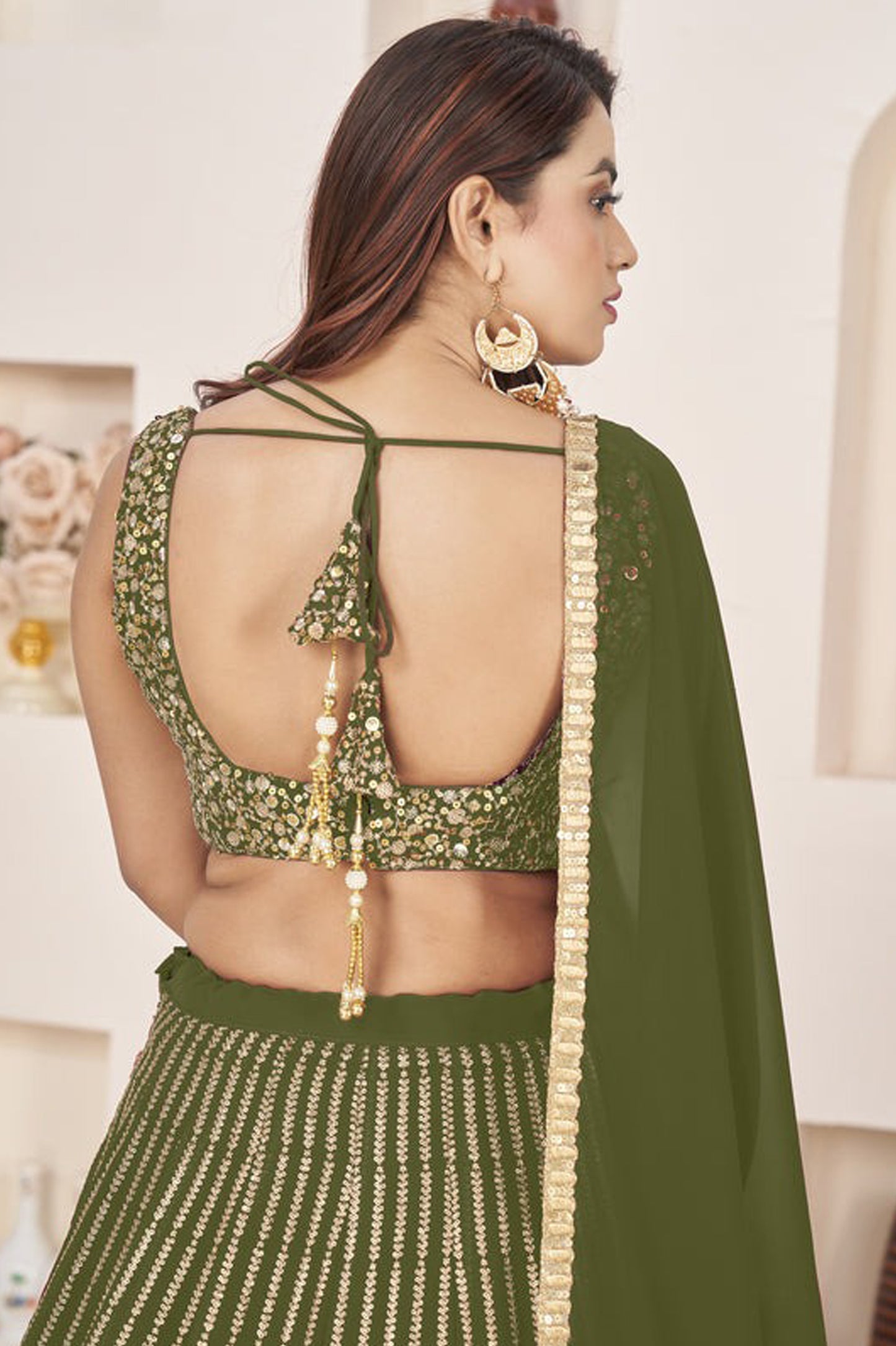 Back view of choli ghagra with zari work accents