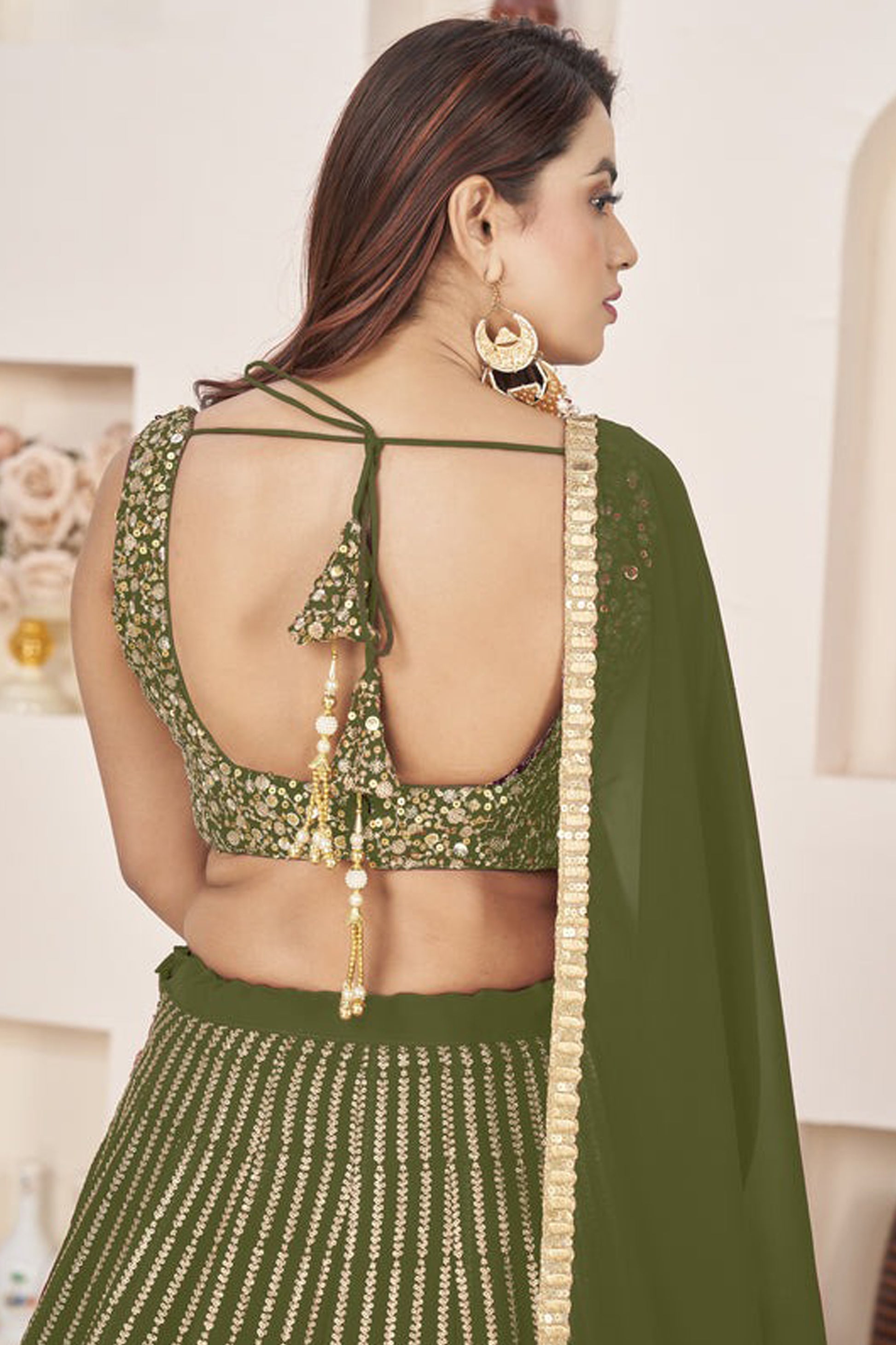 Back view of choli ghagra with zari work accents