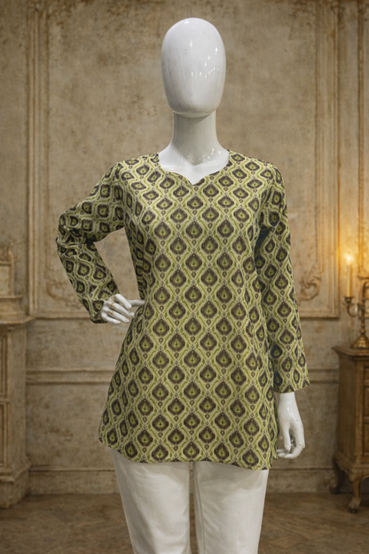olive green tunic top paired with white pants full outfit