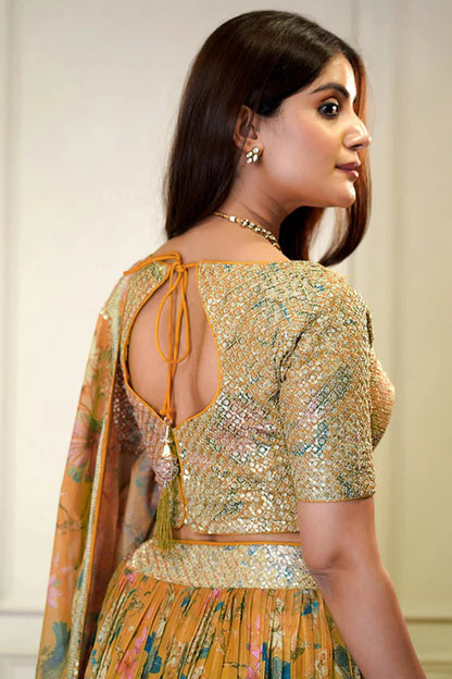 side profile of orange lehenga choli with flowing dupatta
