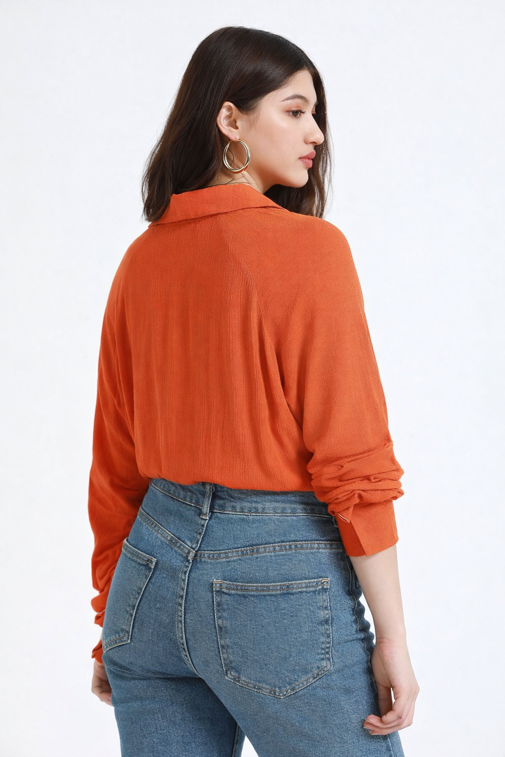 Back view of orange shirt in soft crepe fabric