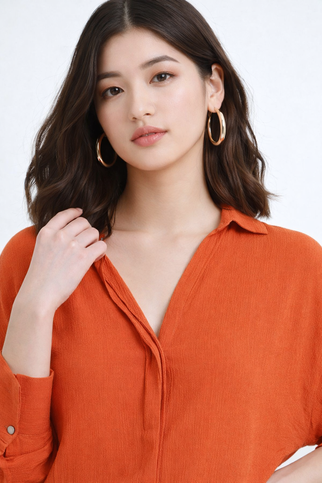 Collar detail of stylish orange shirt for womens wear