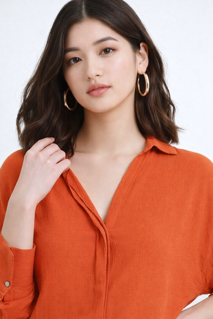 Collar detail of stylish orange shirt for womens wear