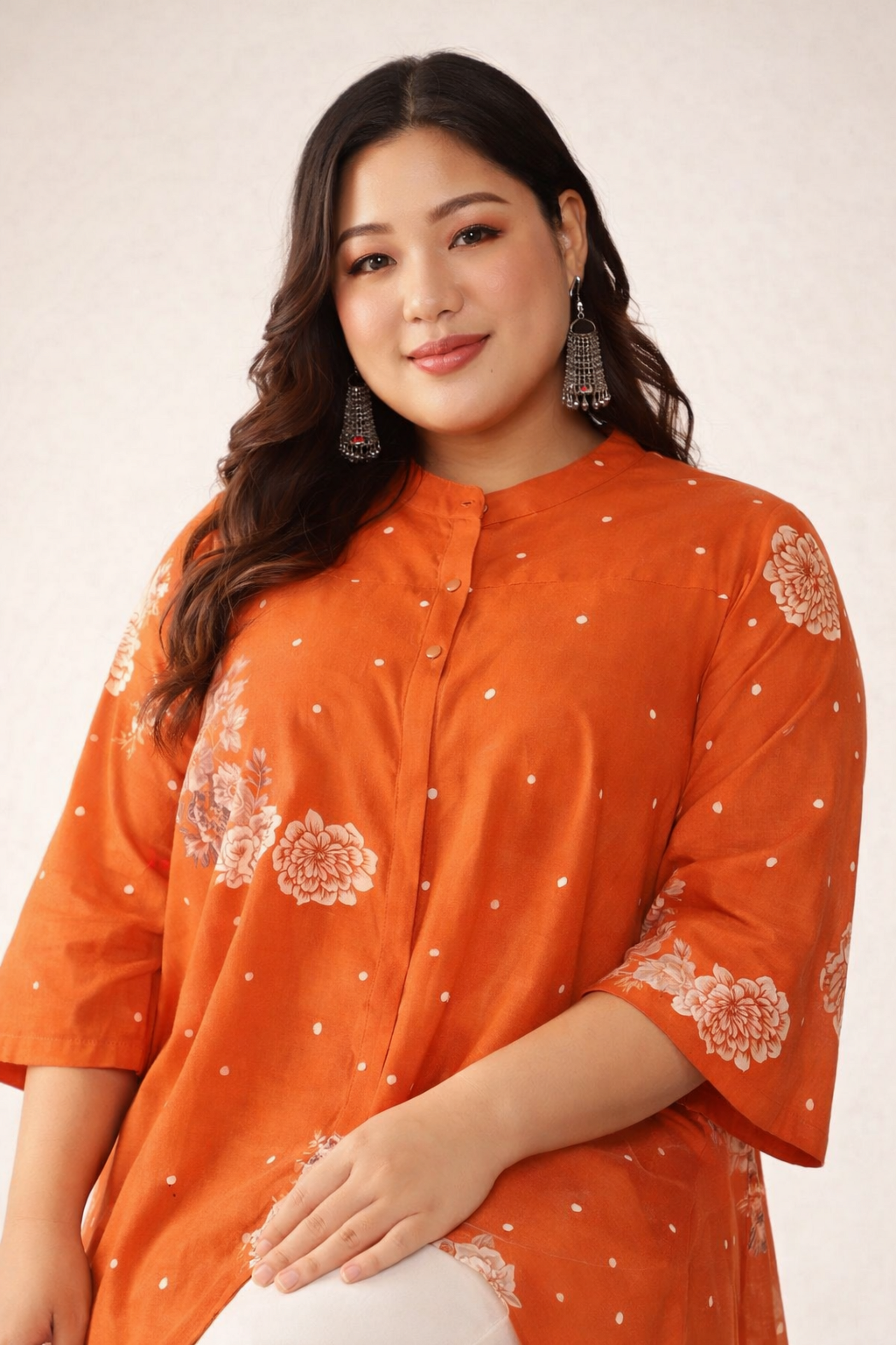 Orange cotton top with printed design close-up