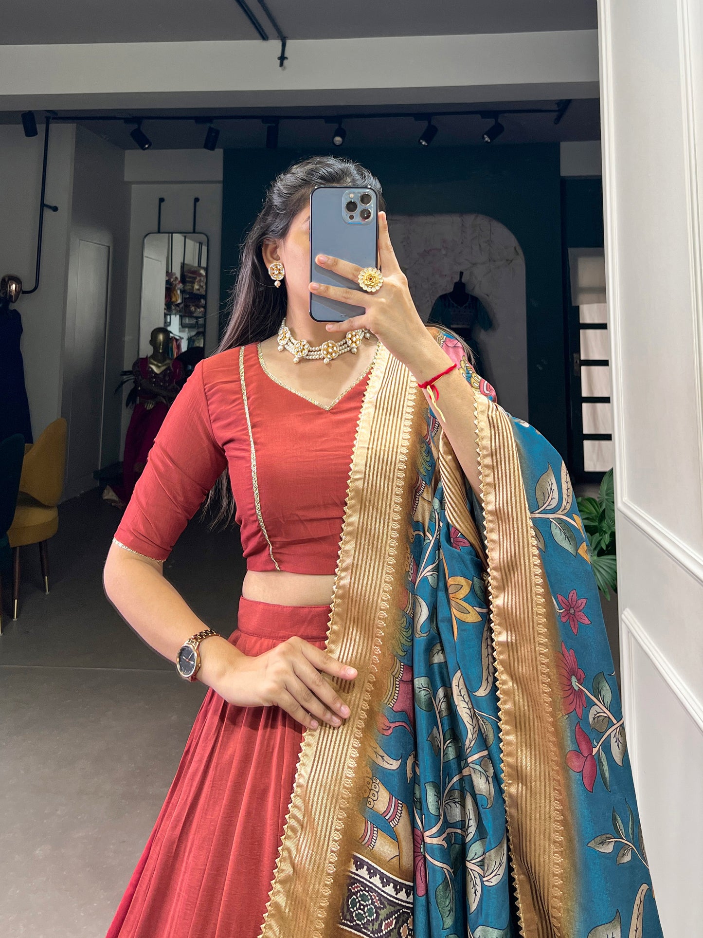 Orange lehenga choli with foil print detail close up