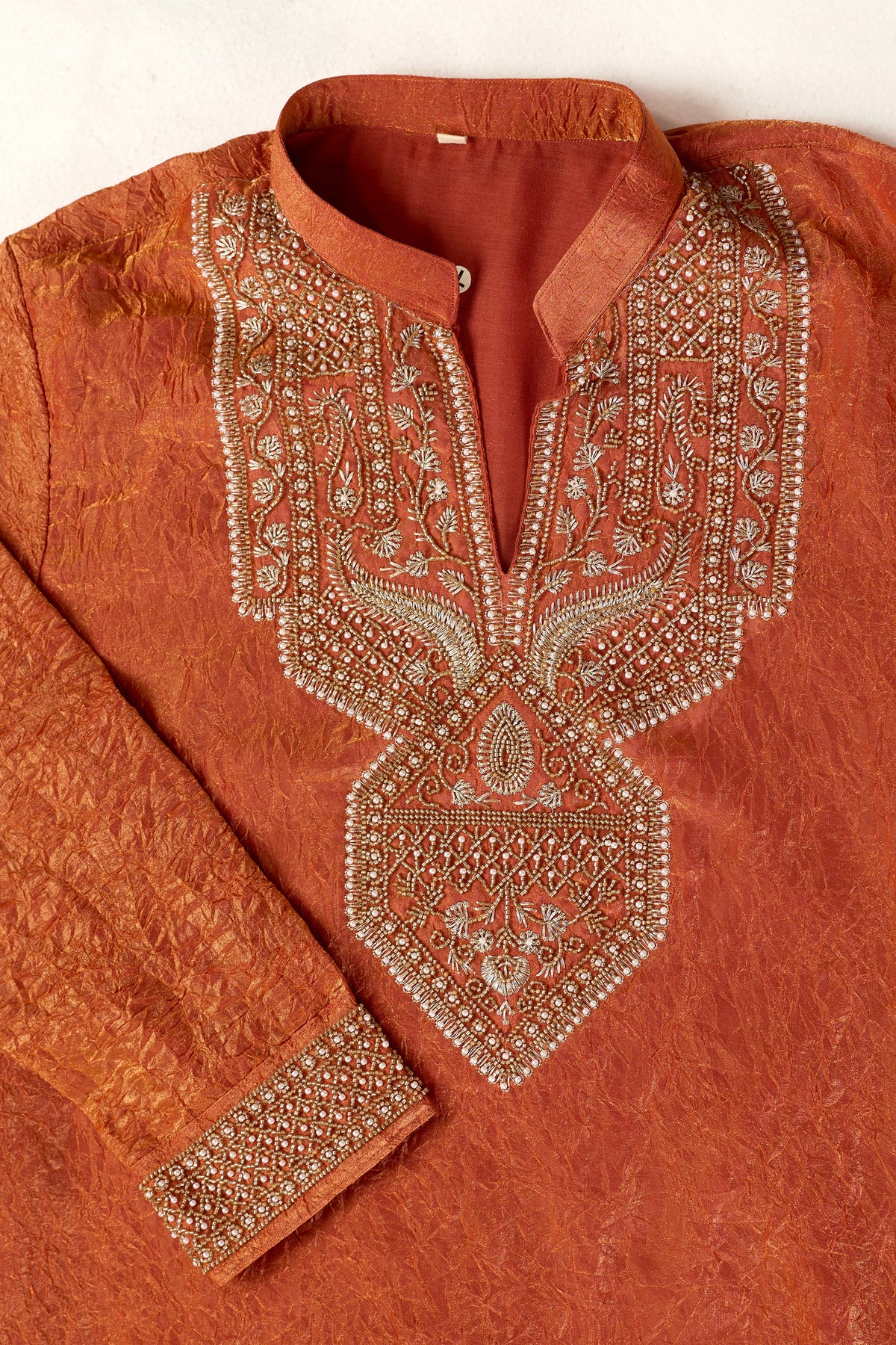 Orange men’s kurta for Eid celebration
