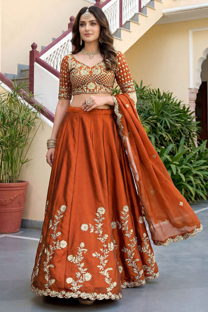 Dori embroidery detail on orange lehenga blouse