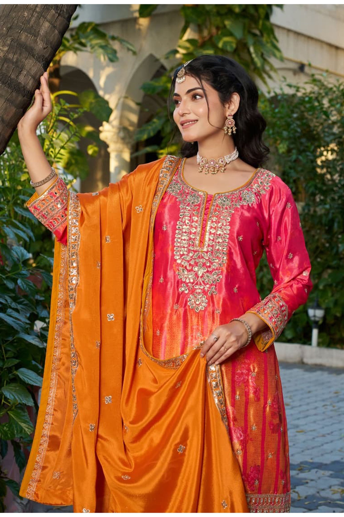 Model wearing Orange Palazzo Suit with festive styling