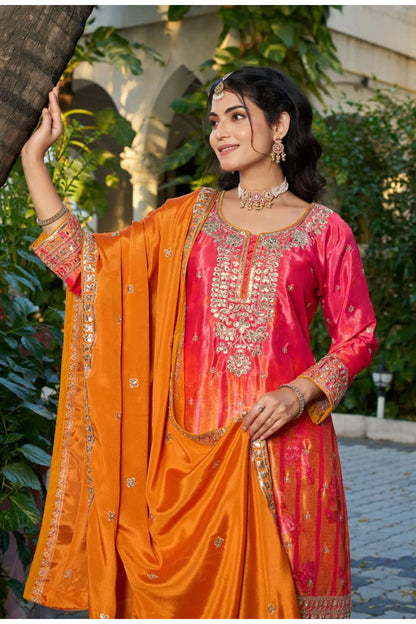 Model wearing Orange Palazzo Suit with festive styling