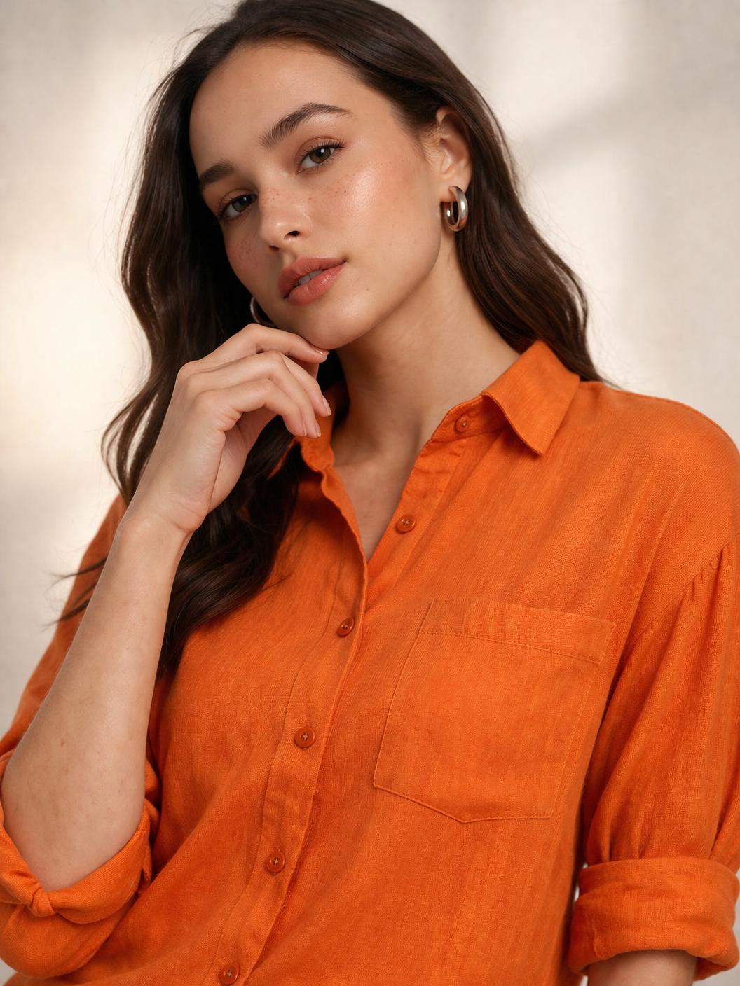 Cotton orange shirt close-up showing smooth fabric texture