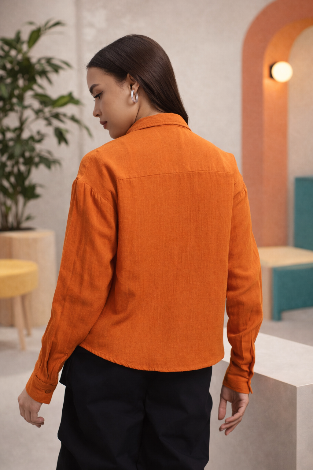 Orange shirt back view showcasing structured silhouette