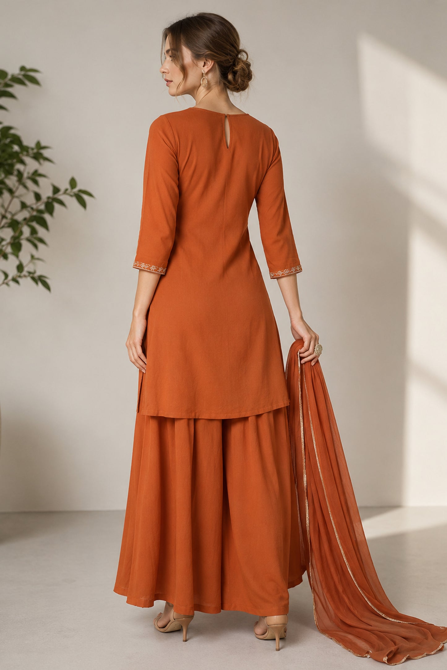 Full back view of the orange silk sharara outfit