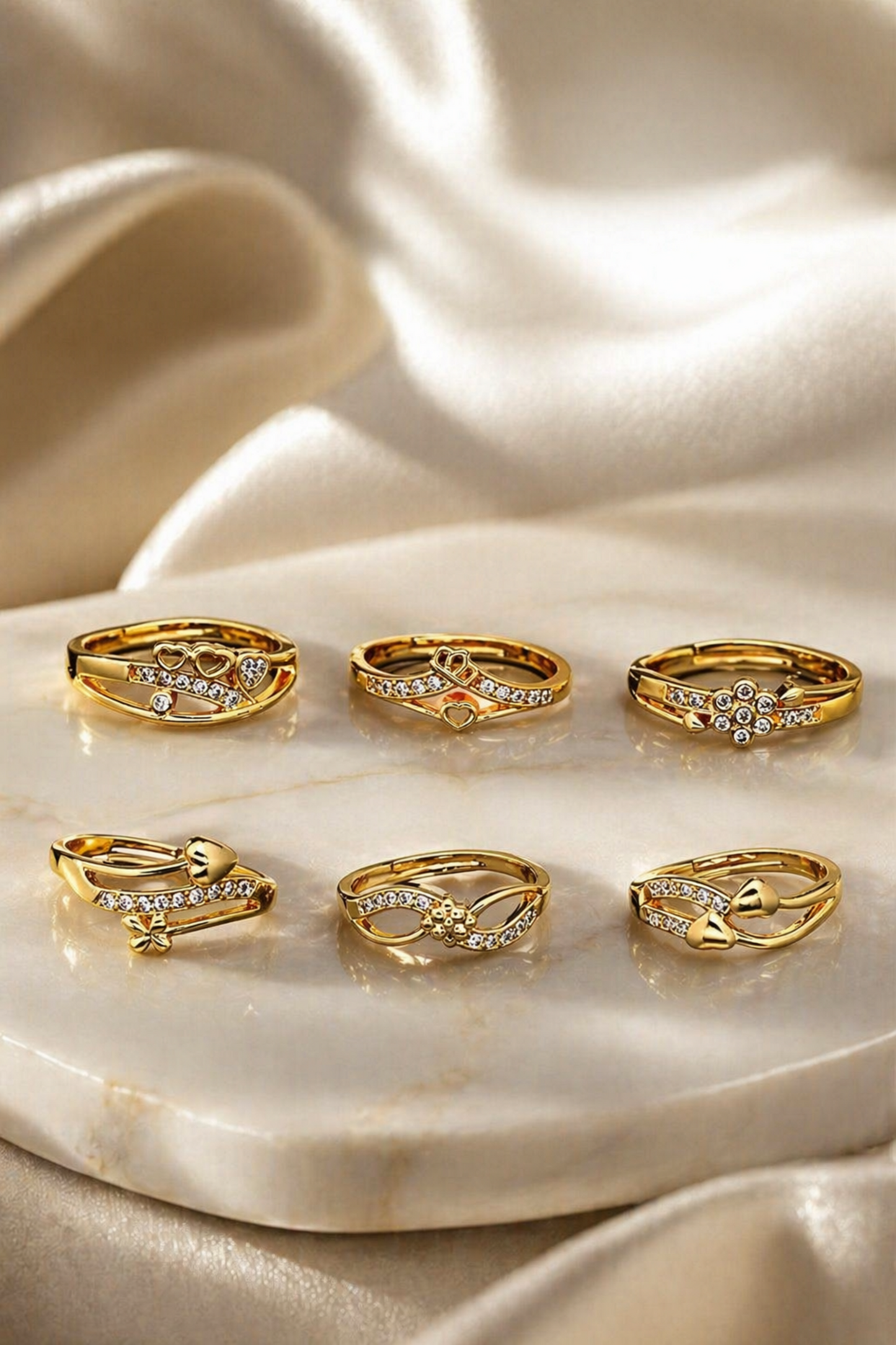 gold diamond rings set for women on marble
