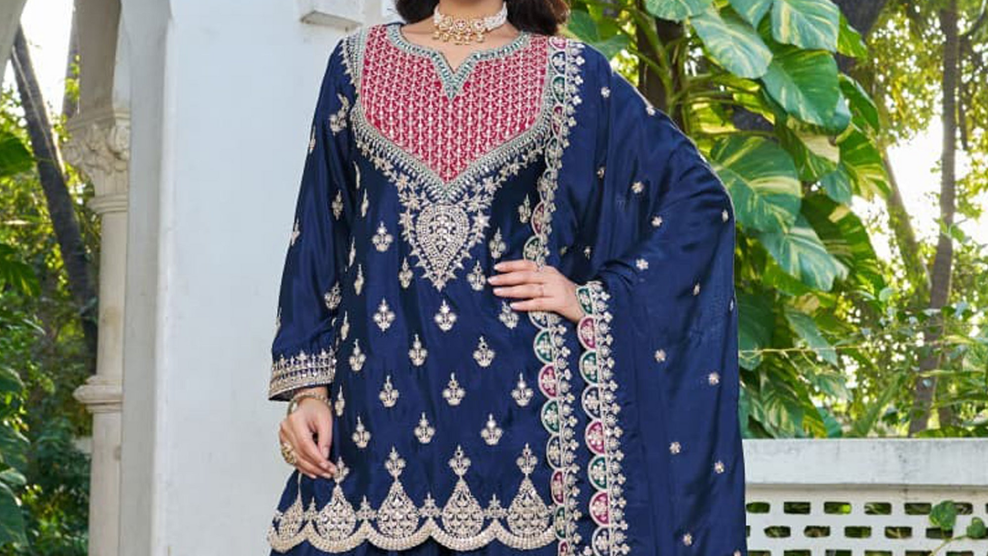 Full heavy embroidery detail on navy blue palazzos