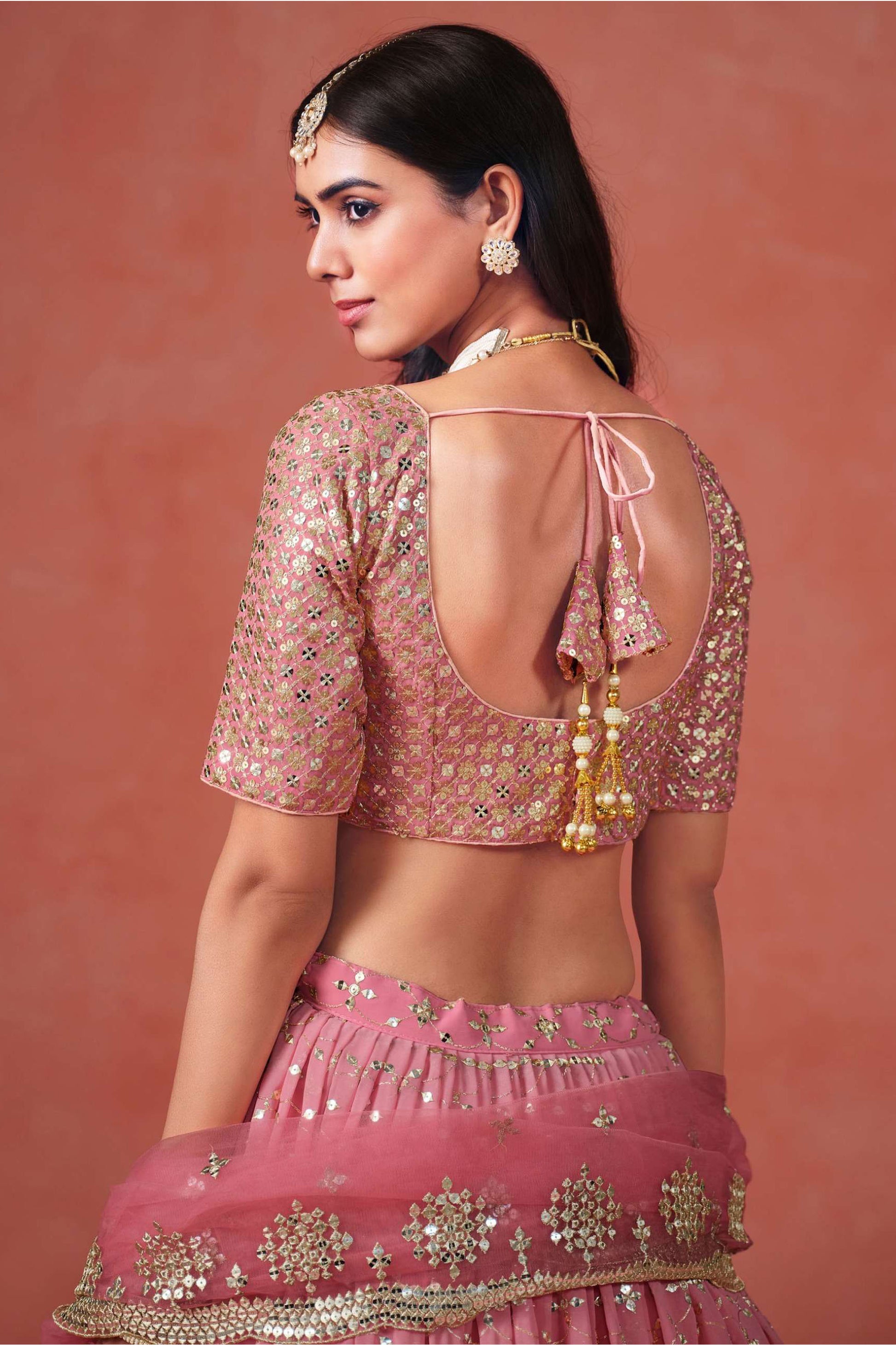 Close-up of intricate zari and sequins embellishment