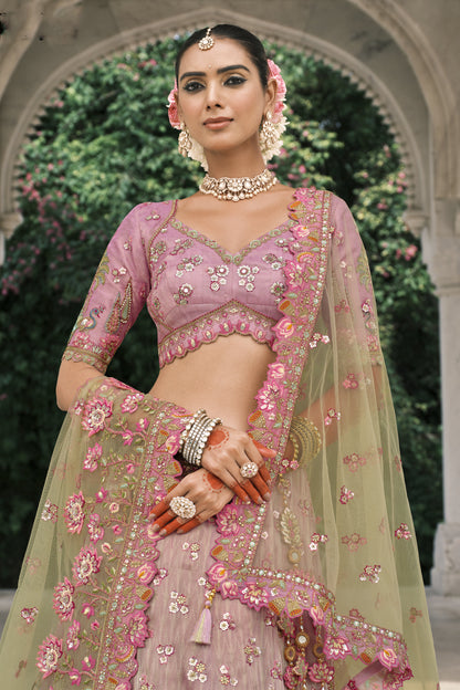 Traditional zari embroidery detail in pastel pink lehenga