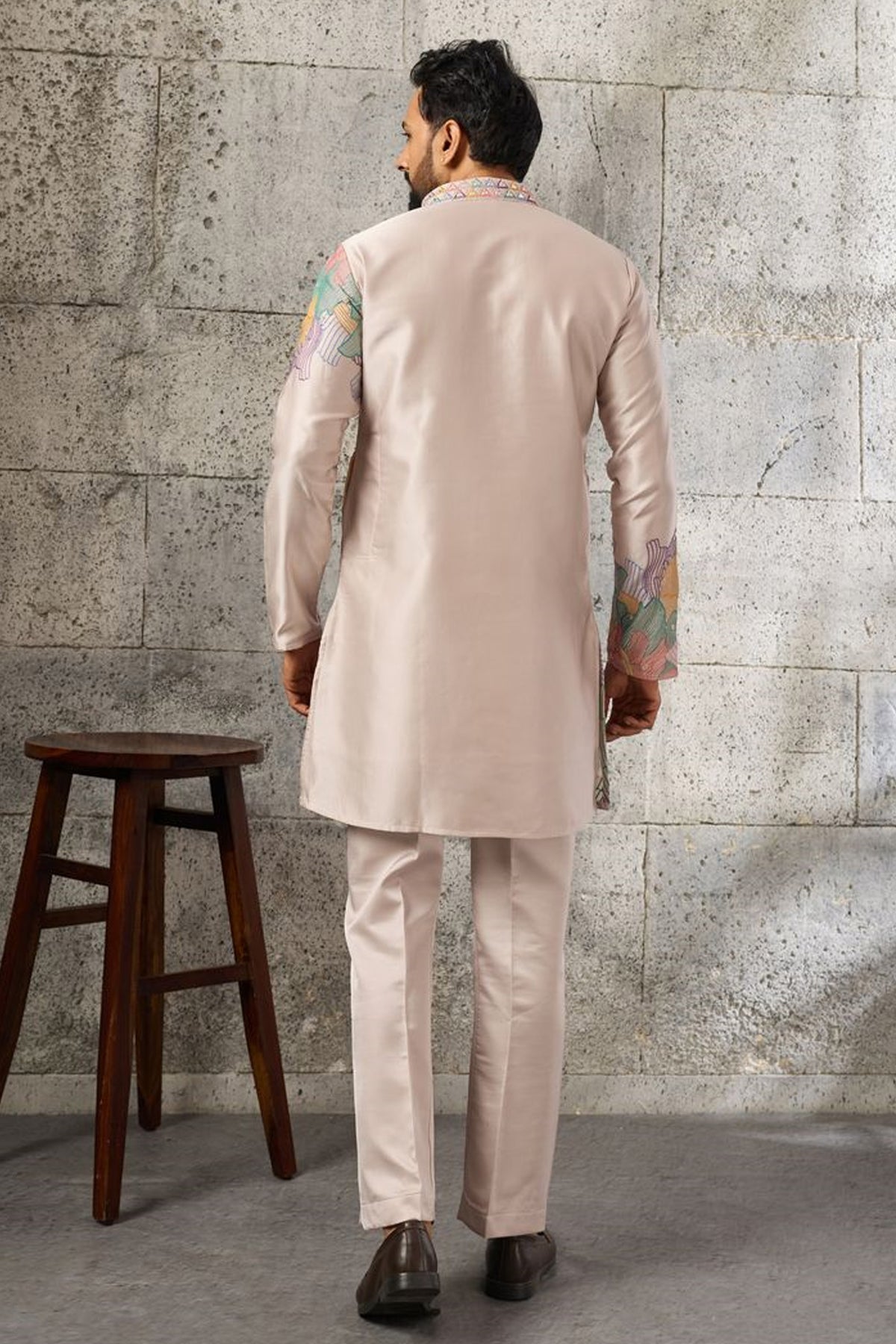 Peach stitched men's kurta with thread and sequin embroidery.