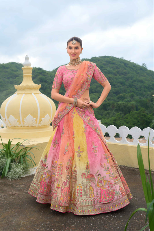 Peach lehenga front view in shaded peach and yellow tones
