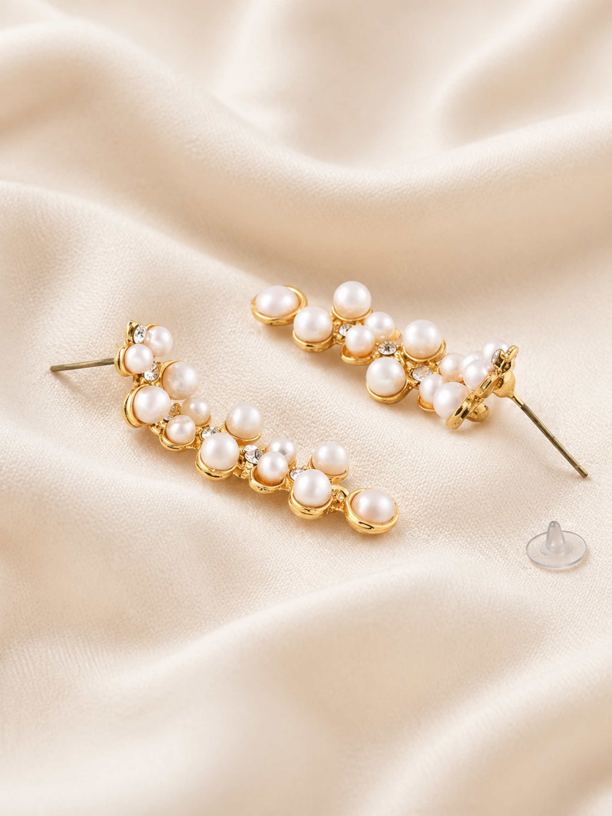 minimal pearl necklace set on soft fabric