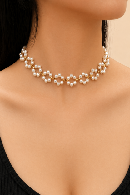 elegant pearl necklace close-up on satin background
