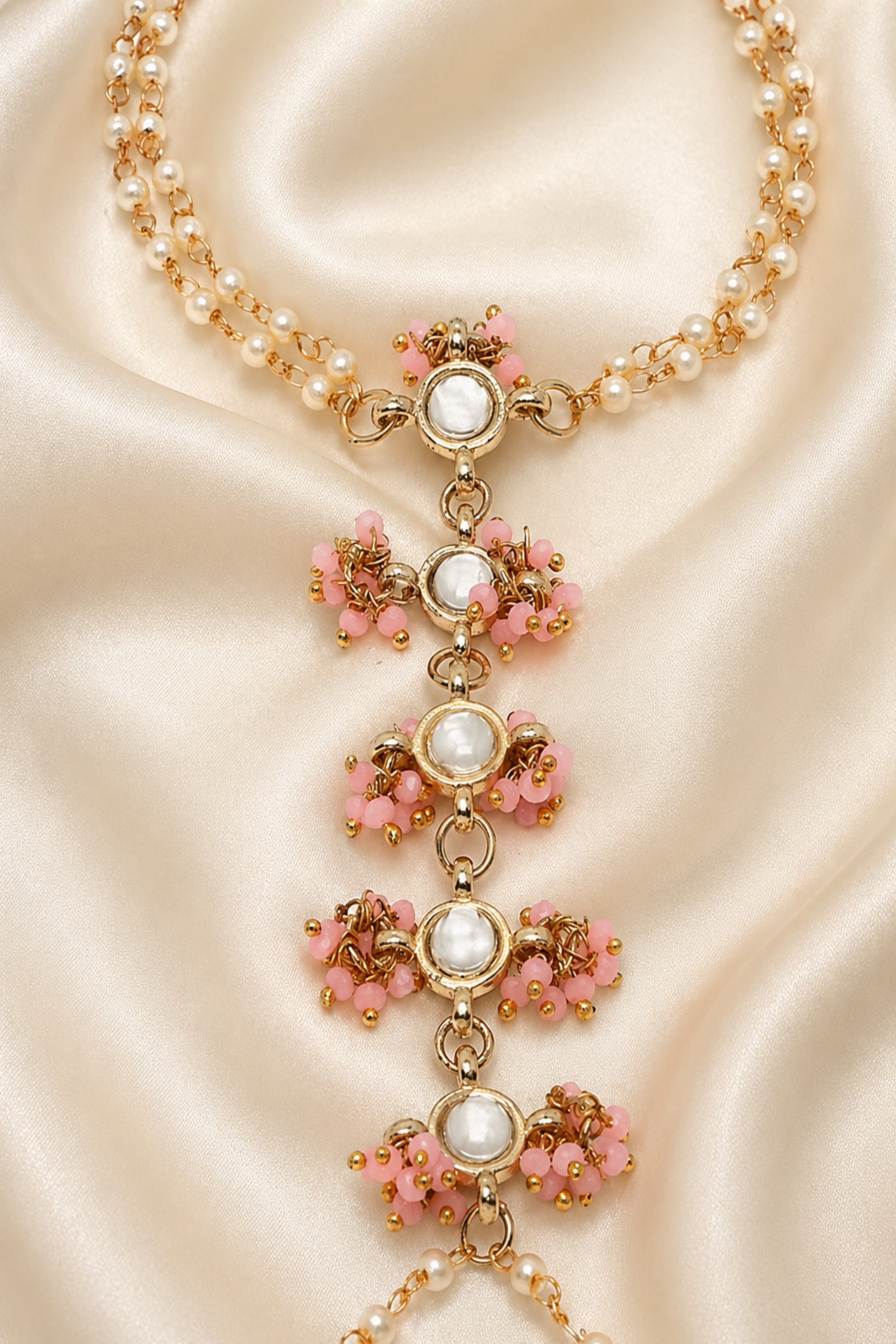 pink bead and clear stone hand jewelry detail