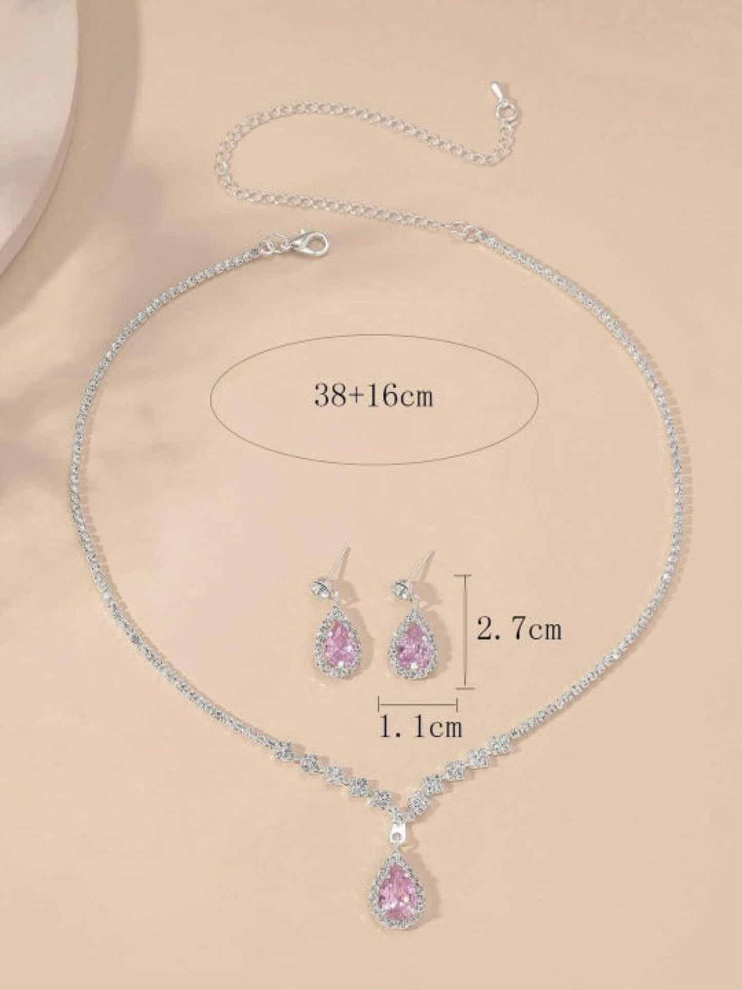 minimal silver finish jewelry set with pink stones