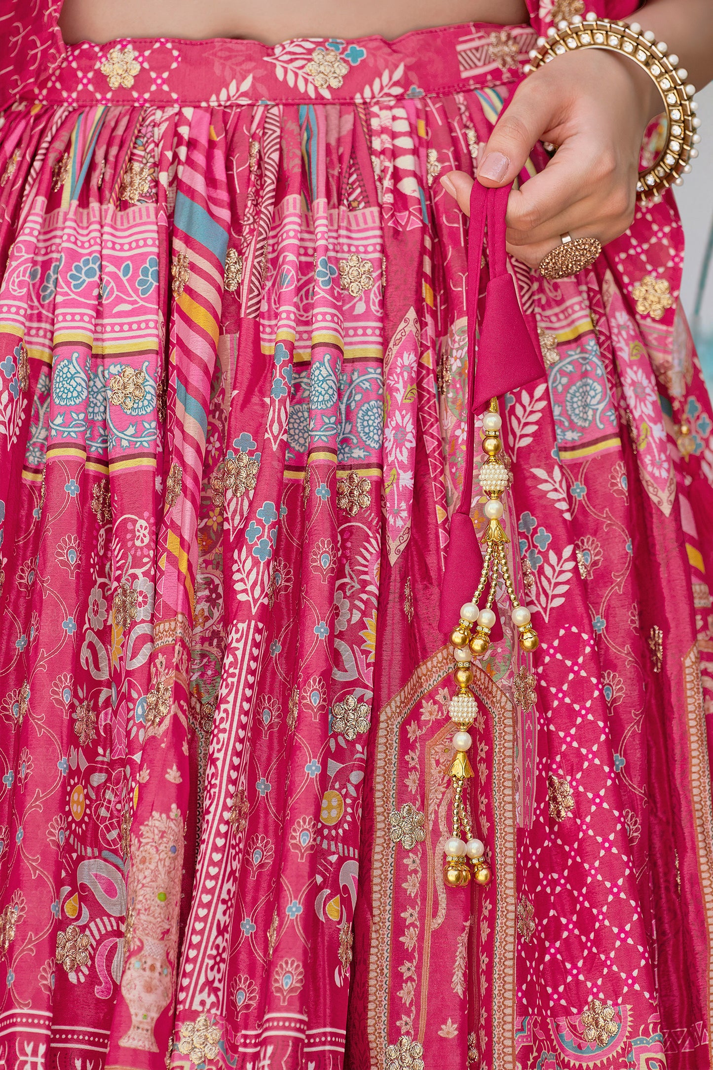 Pink lehenga choli with detailed embroidery close view