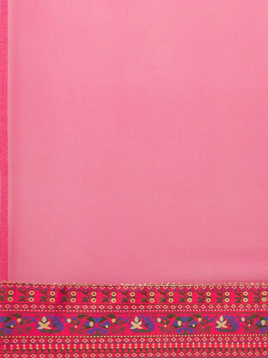 Soft pink dress detail highlighting craftsmanship