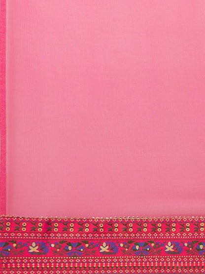 Soft pink dress detail highlighting craftsmanship