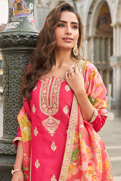 Close up of embroidery work on pink kameez