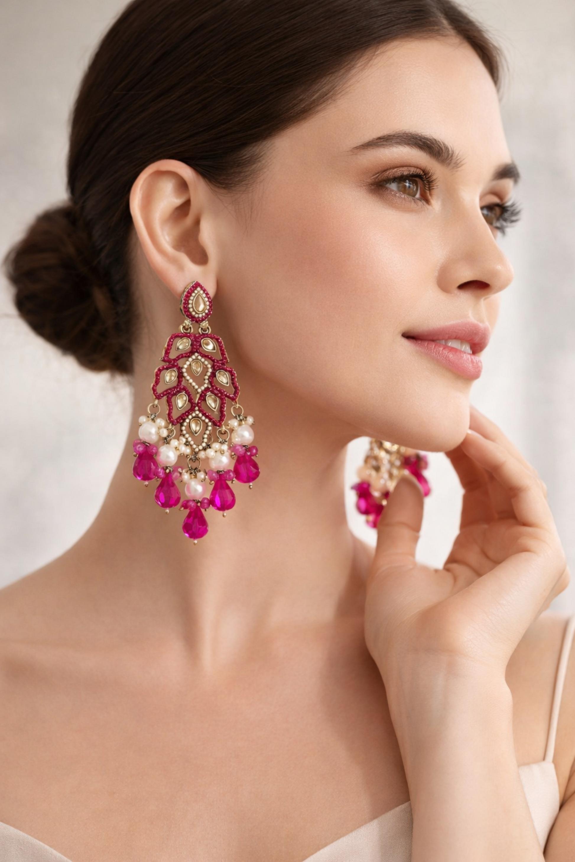 gold tone earrings with pink stones and pearls