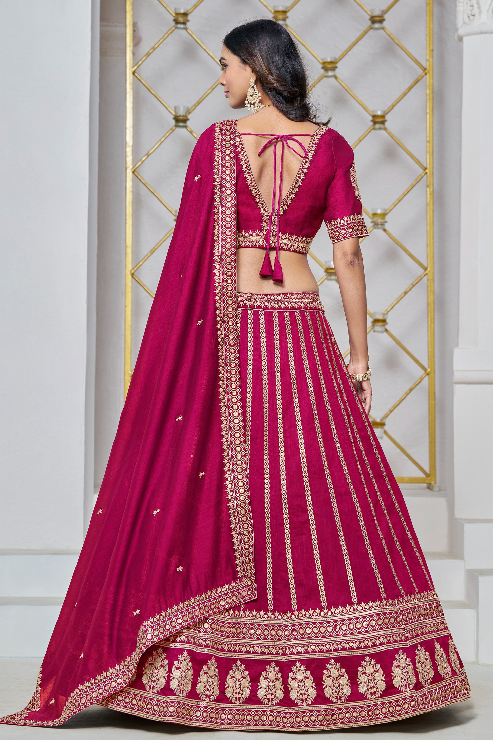 Back view of lahenga choli in dark pink tone