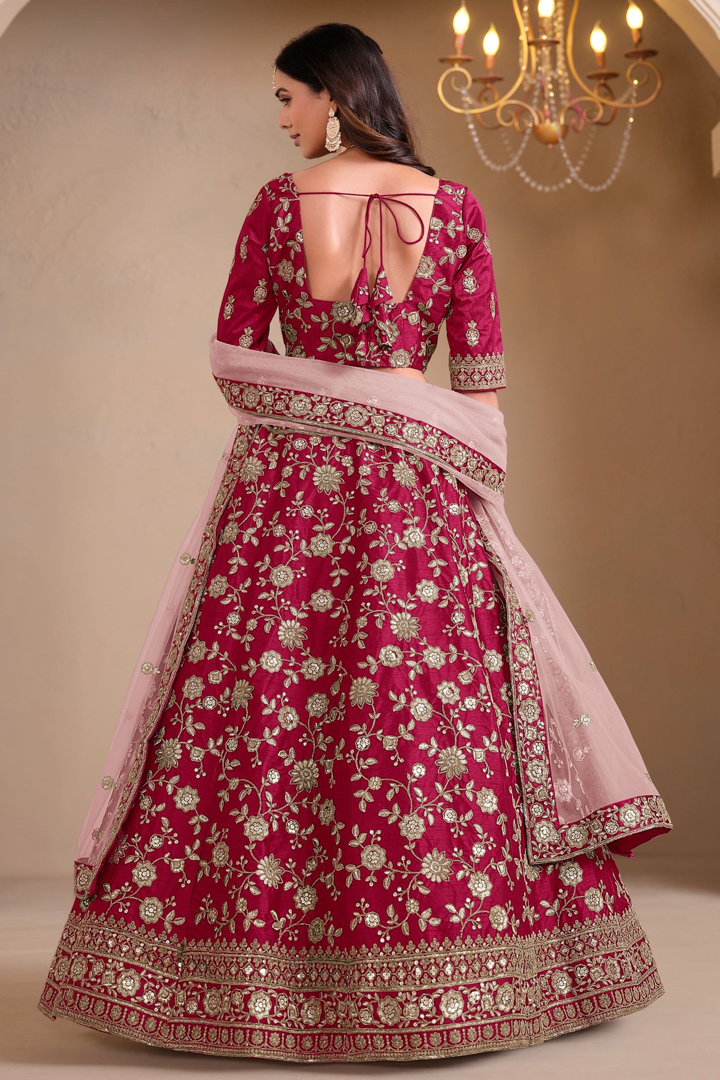 Back view of pink embroidered lehenga choli set