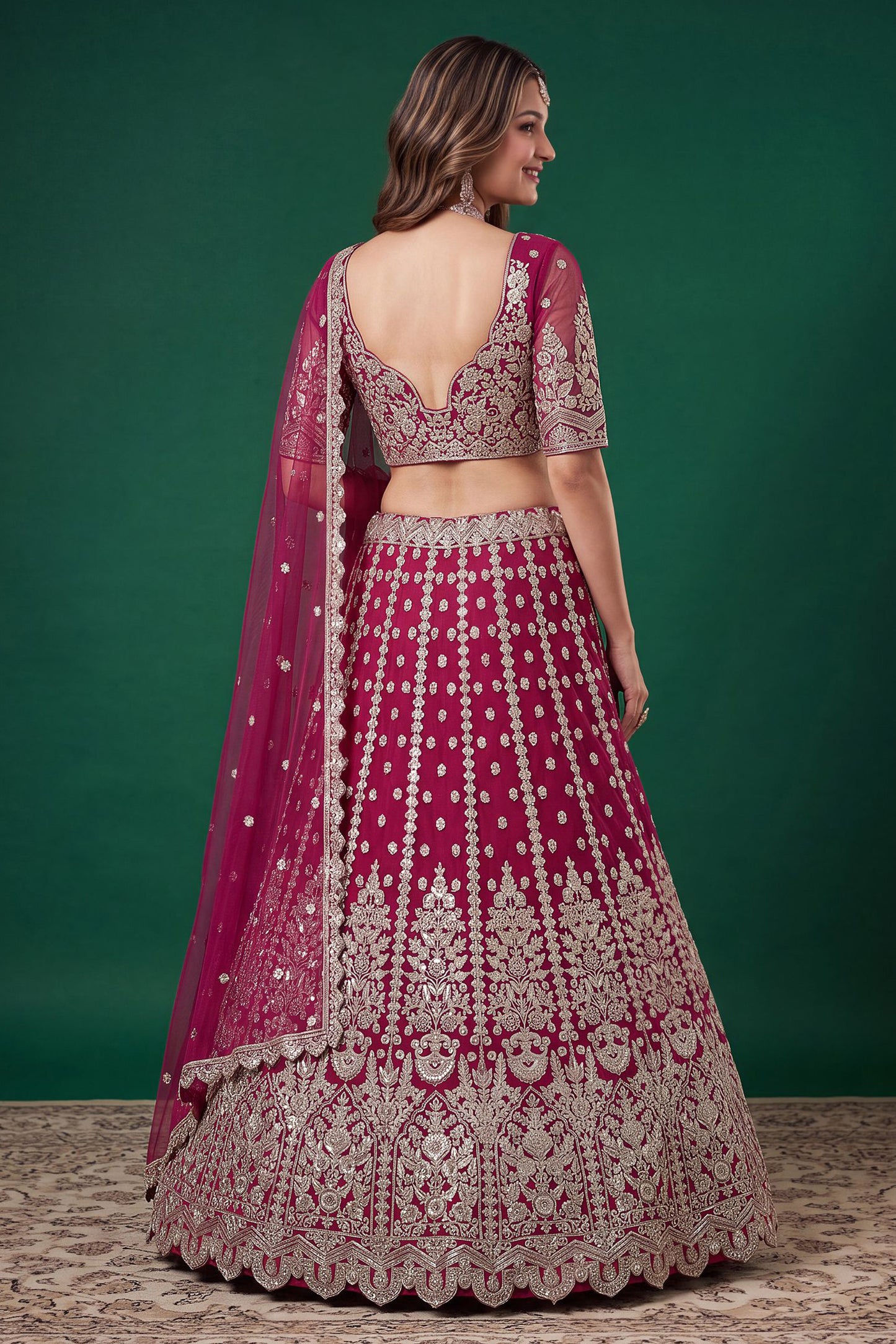 Lehenga choli in pink colour showing the full back design