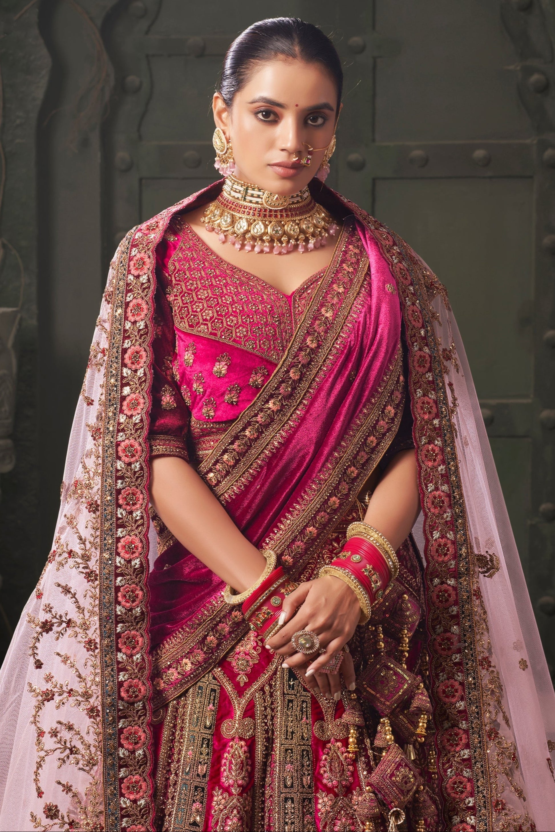 Reception wear lehenga choli in pink velvet fabric