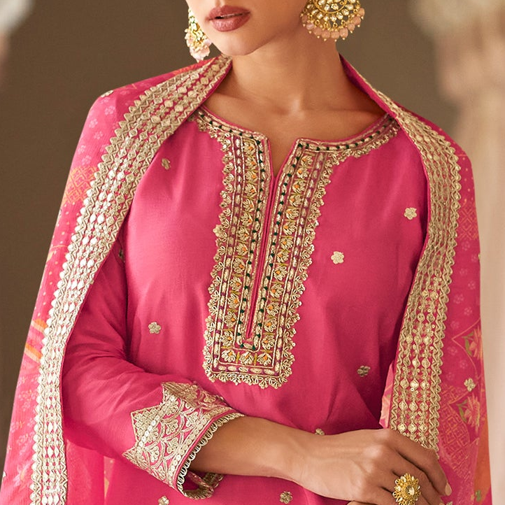 Neckline embroidery detail on pink kameez