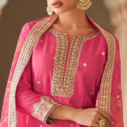 Neckline embroidery detail on pink kameez