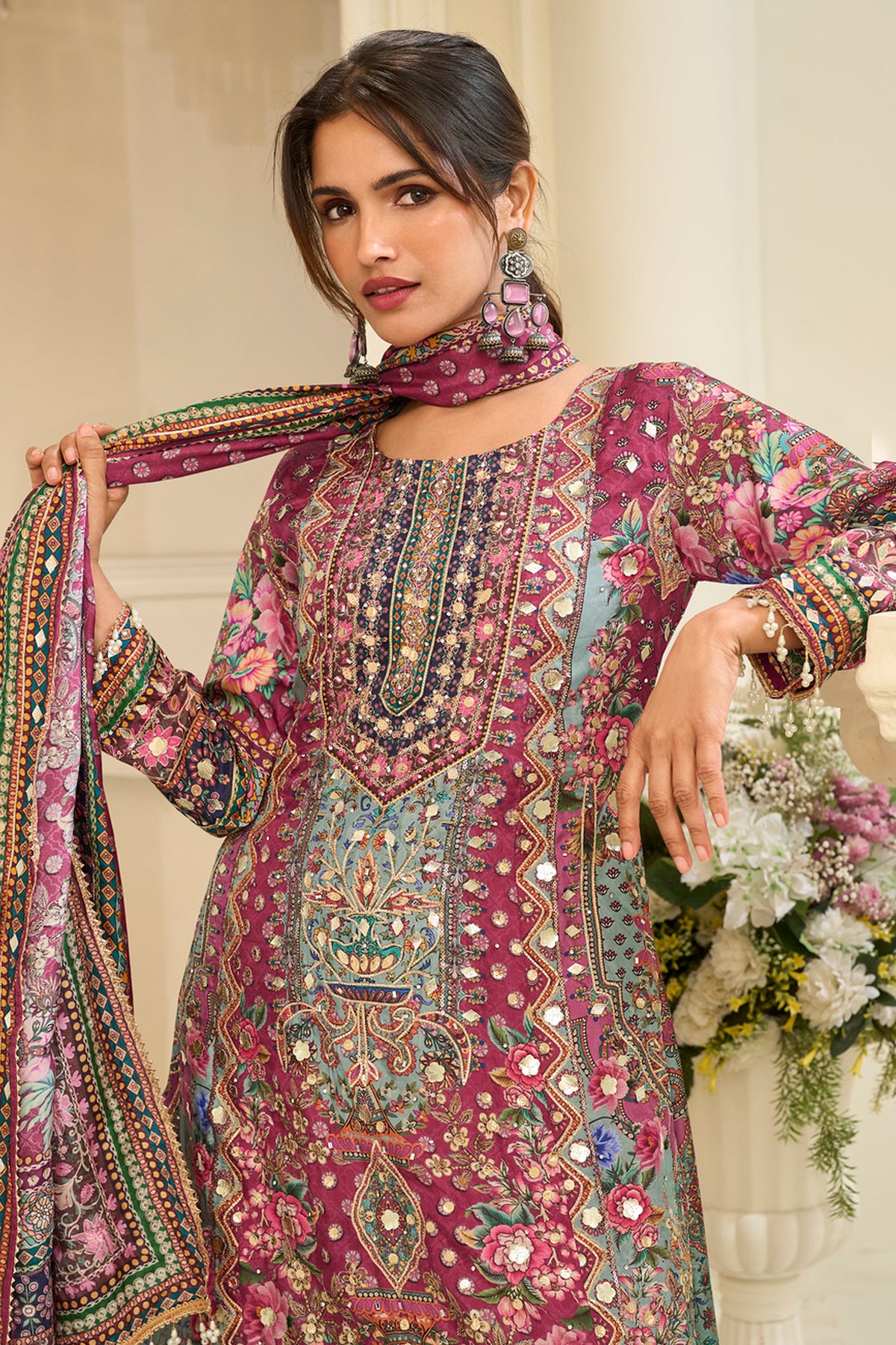 Hem detail of the pink outfit with decorative work