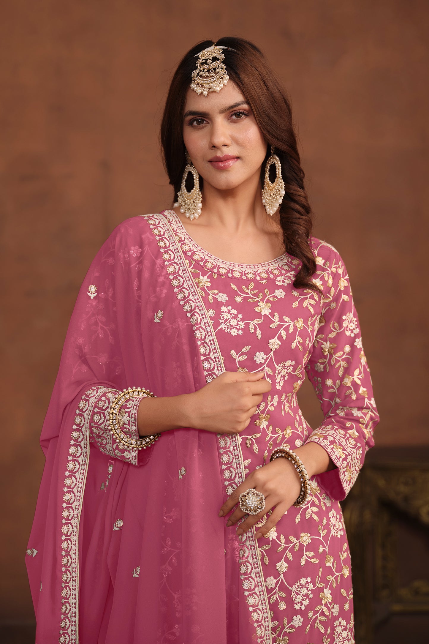 Side view showing embroidery detail on pink kameez palazzo suit