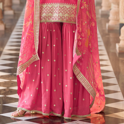 Model wearing pink salwar kameez sharara at festive event