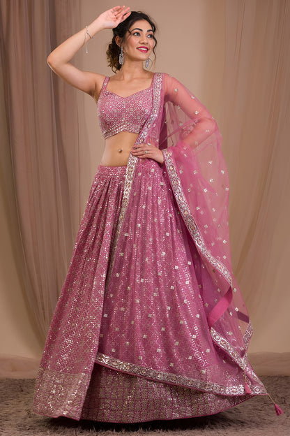 Festive pink lehenga outfit with zari embroidery accents