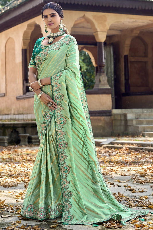 Pistachio Green Saree exudes calm elegance and freshness – ideal for weddings, Eid, or summer gatherings.
